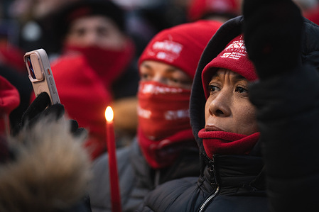 A woman holds up her phone during a vigil for Alex Pretti at the Veterans Affairs New York Harbor Healthcare System on Thursday, January 29 2026 in New York, New York, USA. Alex Pretti, a 37-year-old ICU nurse at the Minneapolis VA hospital, died January 24 after being shot multiple times during a brief altercation with border patrol agents.