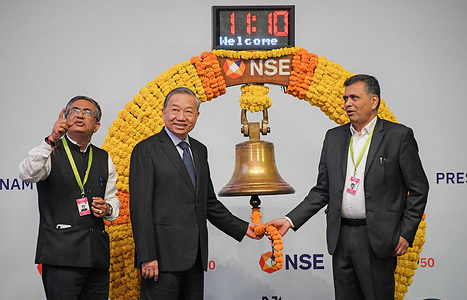L-R Ashish Kumar Chauhan, Managing Director (MD) and Chief Executive Officer (CEO) of National Stock Exchange (NSE), To Lam, General Secretary, President of Republic of Vietnam and Srinivas Injeti, Chairperson, NSE are seen during the bell ringing ceremony at the National Stock Exchange (NSE) in Mumbai.