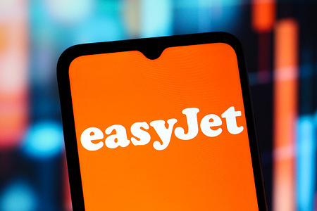 In this photo illustration, the EasyJet (Easy Jet) logo is seen displayed on a smartphone screen.