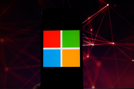 In this photo illustration a Microsoft logo is seen displayed on a smartphone.