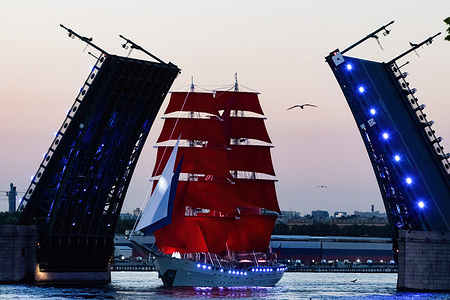 The brig "Russia" in the waters of the Neva River seen during the rehearsal of the Scarlet Sails alumni holiday, which will be held from June 28 to 29 in St. Petersburg. The annual music and theater youth festival "Scarlet Sails" is held on the Neva. The main event of the festival is the ceremony of raising the red sails on the brig "Russia", which sails along the Neva River in the center of St. Petersburg. As part of the celebration, a large concert is held in Dvorvotsa Square, and guests will also enjoy a large fireworks display. The Scarlet Sails holiday is considered one of the brightest summer events in St. Petersburg and a symbol of graduation for Russian schoolchildren.