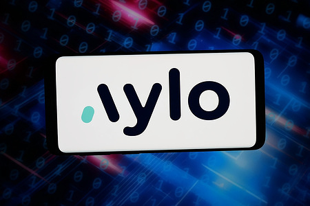 In this photo illustration, the logo of Canadian pornographic company Aylo is displayed on a smartphone in front of abstract background on computer screen.