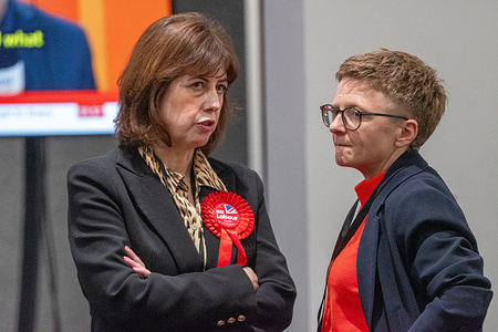 (L-R) Lucy Powell, Deputy Leader of the Labour Party, and Bev Craig, the leader of Manchester City Council, look nervous at the vote Count for the Gorton and Denton by-election at counting station.
