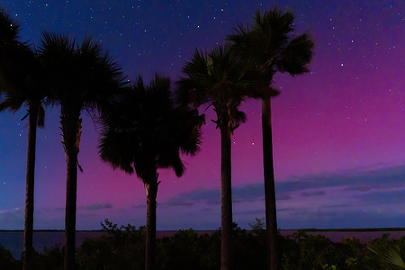 The Northern Lights are seen in Sugarloaf Key, just 15 miles from Key West. According to the Space Weather Prediction Center, a severe geomagnetic storm began Tuesday night, making the lights visible much further south than usual.