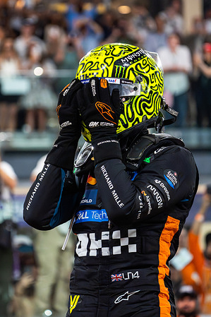 McLaren Formula 1 Team's English driver Lando Norris celebrates winning the drivers world champions during the Formula 1 Abu Dhabi Grand Prix 2025 at Yas Marina Circuit.