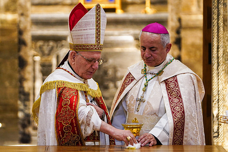 Cardinal Louis Raphael Sako, the Patriarch of the Chaldean Catholic Church (L), with Archbishop Najib Mikhael Moussa, Chaldean Archbishop of the Archdiocese of Mosul and Aqrah, hold the consecration ceremony of Al-Tahira Chaldean Church after its reconstruction. The restoration of the Al-Tahira Chaldean Church, which dates back to the mid-18th century, was part of the “Mosul Mosaic” initiative to preserve the city’s diverse cultural heritage. The project, launched in 2019, was led by L’Œuvre d’Orient in collaboration with the State Board of Antiquities and Heritage, the French Institut National du Patrimoine (INP), and the Chaldean Archdiocese, with funding from the ALIPH Foundation.