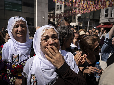 A Kurdish woman cries as she watches Emine Ocak's coffin being brought to Galatasaray Square for her funeral. Relatives of Emine Ocak and human rights defenders hold a commemoration at her coffin in Galatasaray Square, the symbolic site of the protests. It was announced yesterday that 89-year-old Emine Ocak, a prominent figure among the Saturday Mothers who held their 1000th week of protests in May last year, passed away. Emine Ocak was one of the first to take action in the Saturday Mothers' protests, which have been ongoing since 1995.