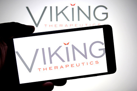 In this photo illustration, a Viking Therapeutics logo is seen displayed on a smartphone and in the background.