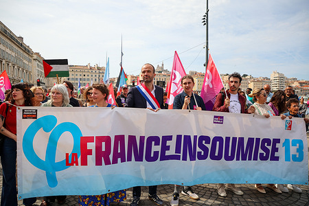 Manuel Bompard (C), a member of parliament for the "La France Insoumise (LFI)" party, holds a banner during the May Day parade in Marseille. Manuel Bompard took part in the traditional May Day parade in Marseille, organized by the unions. According to the police, 3,400 people marched in Marseille.