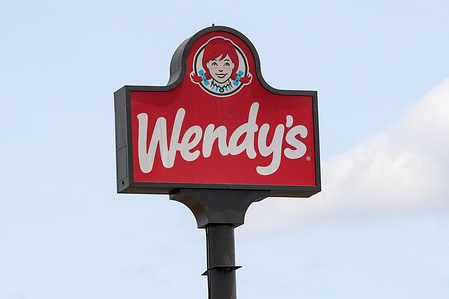 The Wendy's logo is seen on a sign outside of one of its fast food restaurants.