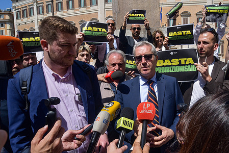 Radicali Italiani President Matteo Hallissey (L) and Member of Parliament Benedetto Della Vedova (R) speak to the press in front of the Parliament. The initiative was organized by Radicali Italiani to protest against drug prohibition and demand the legal regulation of cannabis through public non-violent action.