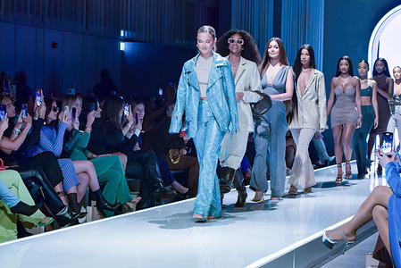 Molly Mae leads the models on the runway during the PrettyLittleThing X Molly-Mae show at The Londoner Hotel in London.