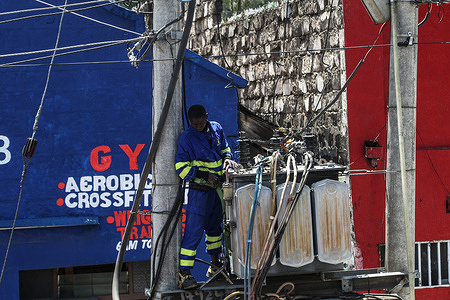 A technician repairs an electricity transformer on Kenyatta Lane in Nakuru Town. The government of Uganda last week began importing electricity from Kenya to plug a power shortfall after floods caused a shutdown of 183Megawatt at Isimba hydro-power dam. The dam, commissioned in March was partly financed by China’s Exim Bank.