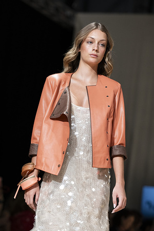A model walks the runway wearing a design by UNIENDO MODA during the Momad Fashion Week de Madrid in IFEMA.