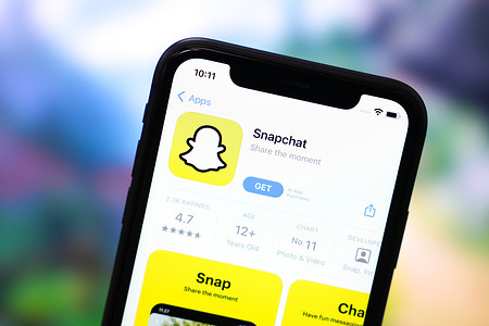 In this photo illustration, the Snapchat App seen displayed on the screen of a smartphone.