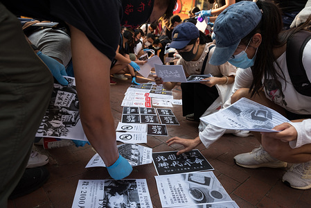 Protester paste flyers and placards to the ground to create a 'Lennon Wall' stretching over multiple districts during the demonstration.
Demonstrators gathered for an anti-authoritarian rally that marked the 5th anniversary of the beginning of the 2014 'Umbrella Movement'. Thousands of protesters gathered peacefully, but minor clashes between protesters and police escalated through the night, leading to a police dispersal operation. Protesters continue to clash with police as they reiterate their 5 demands.