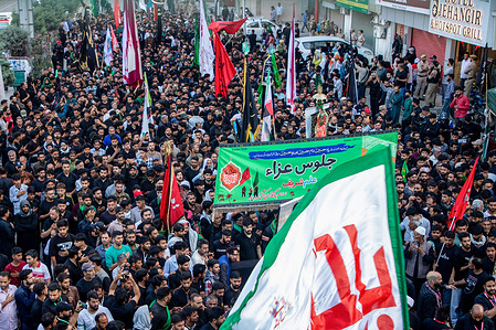 Kashmiri Shiite Muslims hold religious flags as they take part in an eighth day Muharram procession in Srinagar, the main city in Indian-administered Kashmir. Muharram processions draw thousands of mourners commemorating the martyrdom of Imam Hussain, the grandson of Prophet Muhammad. This year's observances unfold amid heightened tensions in the Middle East following the conflict involving Iran, Israel and the United States and the killing of Iran's Supreme Leader Ayatollah Ali Khamenei.