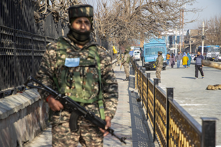 Indian paramilitary troopers stand alert outside the main venue where the authorities held the main function, during India's 76th Republic Day celebrations in Srinagar. India's Republic Day marks the proclamation of India as a republic in 1950, three years after it won independence from British rule.