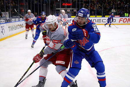 SKA Hockey Club player, Mikhail Vorobyov (42) and Spartak Hockey Club player, Roman Rukavishnikov (5) seen in action during the Kontinental Hockey League, regular season KHL 2023 - 2024 between SKA Saint Petersburg and Spartak Moscow at the Ice Sports Palace. 
(Final score; SKA Saint Petersburg 3:2 Spartak Moscow)