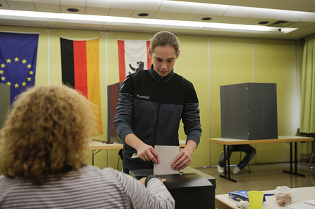 A woman is seen putting her ballot papers into the ballot box. Around 61.5 Million Germans are called to the polls today, to vote for the next Bundestag (Parliament) in a General Election. Angela Merkel’s CDU party is expected to win the election for a fourth time in a row.