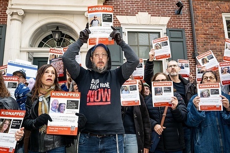 Protesters hold placards during a rally for the freedom of hostages held by Hamas in Gaza. The rally took place in front of the home of United Nations Secretary General Antonio Guterres on Sutton Place in New York City.