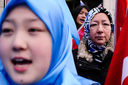 A woman seen shouting slogans during a protest against the Chinese policies in Xinjiang. Activists protest the treatment of Uyghur Muslims by Chinese authorities in the East Turkestan region of China's Xinjiang province at a protest outside the Chinese embassy in central London.