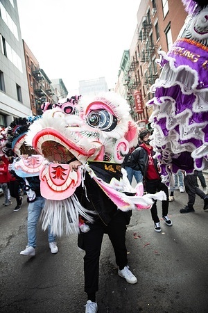 People perform dragon dances through Chinatown during parade.
Chinatown celebrates its annual Lunar New Year with a parade, dragon dances, confetti, and performances.