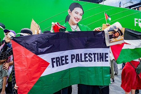 Protestors wave Palestine flags at a pro-Palestine protest. The protest was part of the global March to Gaza and was organized by Thailand Solidarity Campaign.