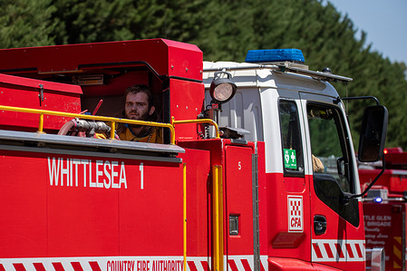 Country Fire Authority crews from Whittlesea are some of the 27 trucks working quickly to contain a grass fire threatening properties as temperatures soar at the tail end of a heatwave. Country Fire Authority firefighters are on the frontlines as grass and structure fires ignite north of Melbourne amidst a searing heatwave. Crews utilize helicopters, fire trucks, and ground equipment to combat the flames, protecting homes and farmland under challenging conditions. This coordinated response showcases the dedication and resilience of CFA personnel, ensuring community safety during heightened fire risks in Melbourne, Australia.