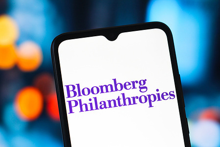 In this photo illustration, the Bloomberg Philanthropies logo is seen displayed on a smartphone screen.