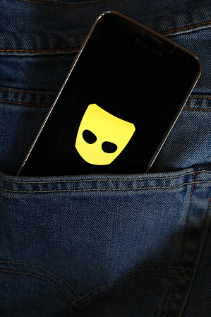 In this photo illustration, a Grindr gay dating app logo seen displayed on a smartphone.