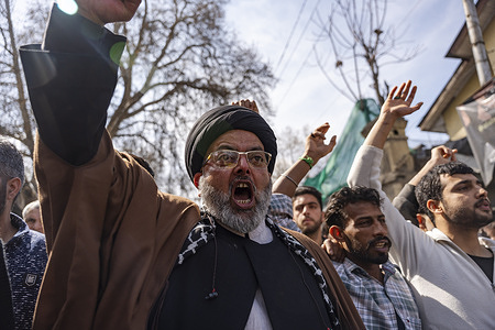 Kashmiri Muslims shouting slogan as they march during a Youm-e-Quds (Quds Day) rally. People take part in a protest march on Youm-e-Quds (Quds Day), an annual event held on the last Friday of Ramadan in support of Palestinians and opposition to Israel, condemning the assassination of Iran’s Supreme Leader Ayatollah Ali Khamenei, as demonstrators carry photographs and chant slogans during the rally.