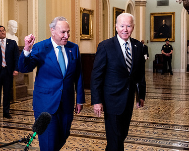 President Joe Biden and Senate Majority Leader, Chuck Schumer (D-NY) walking near the Senate Chamber as the President arrives for a lunch with Senate Democrats at the U.S. Capitol.