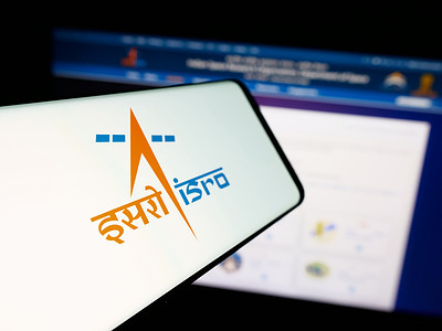 In this photo illustration, a smartphone with the logo of Indian Space Research Organisation (ISRO) is seen on screen in front of website.