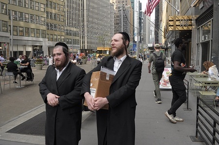 People walk in Manhattan, New York City.