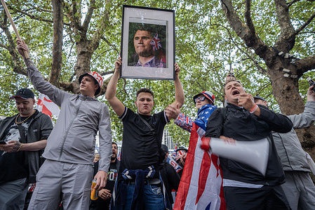 A young patriot holds aloft a picture of the murdered right-wing American Charlie Kirk during the rally. Thousands of Tommy Robinson supporters converged in central London for the latest right-wing rally calling on Downing Street to put a stop to immigration. Far-right activist Robinson’s Unite the Kingdom protest was countered by a Stand Up to Racism march on Whitehall.