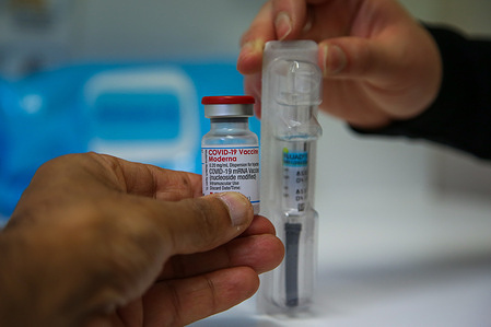 In this photo illustration, Moderna Covid-19 and flu jabs seen at a vaccination centre.