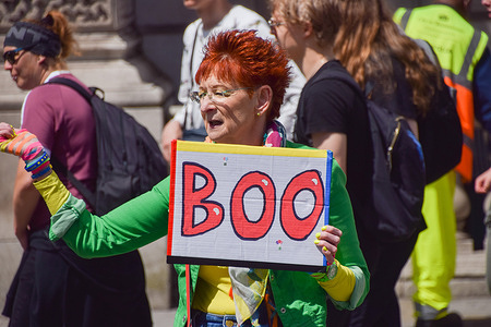 A protester holds a 'Boo' placard during the demonstration outside the Parliament. Anti-Tory protesters gathered in Parliament Square as Boris Johnson faced Prime Minister's Questions.