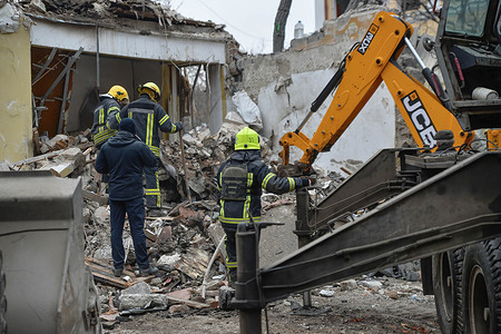 Firefighters work to clear debris after overnight shelling in the city of Kramatorslk. Russian forces continue to attack along the eastern front, shelling in the city has increased.