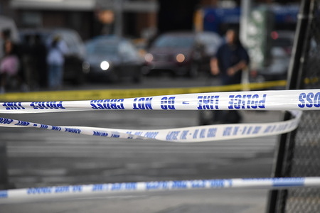 Crime scene tape surrounds the area. At approximately 5:21 p.m. Eastern Time, police responded to a 911 call of a male stabbed at a park located at West 145 Street and Lenox Avenue, within the confines of the 32nd Precinct. Upon arrival, officers observed a 61-year-old male with a stab wound to the chest. EMS responded to the location and transported the victim to Harlem Hospital, where he was pronounced dead. A 63-year-old male was taken into custody, charges pending. The investigation remains ongoing at this time. The deceased has been identified as 61-year-old male, Pressie Taylor.