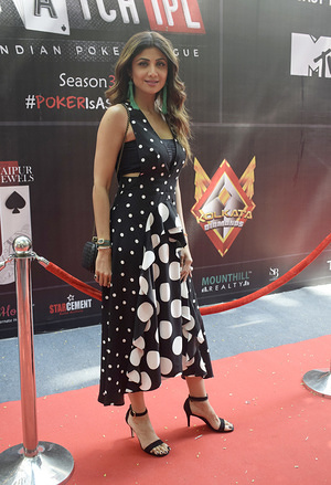 Indian film actress Shilpa Shetty poses for photos during the opening ceremony of Indian Poker League season 3 in Mumbai.