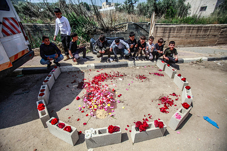 Children gather at the site where the Israeli forces shot dead two Palestinians, in the town of Qabatiya. Israeli army forces killed two Palestinians during an armed clash in the Palestinian town of Qabatiya.