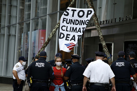 A protester arrested during the demonstration.
New York City Police made arrests as activists stage a sit-in with banners in front of Bank of America on 42nd Street and Sixth Avenue, to raise awareness about environmental issues as the UN General Assembly convenes next week in New York City.