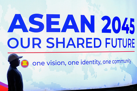 A man walks past the ASEAN 47th Summit billboard during ASEAN Malaysia chairmanship 2025.