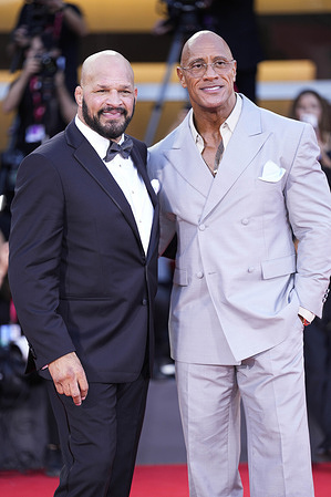 Mark Kerr and Dwayne Johnson attend "The Smashing Machine" red carpet during the 82nd Venice International Film Festival.