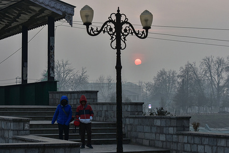 Indian tourists walk downstairs during a cold evening in Srinagar, the summer capital of Jammu and Kashmir.