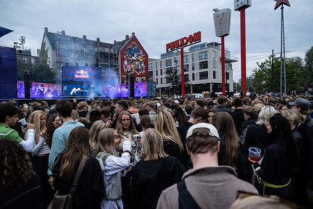 People gather at Den Røde Plads during the Copenhagen Distortion 2025 in the streets of Nørrebro. Copenhagen Distortion 2025 is one of Europe’s largest street and electronic music festivals, transforming the Danish capital into a five-day celebration of nightlife, culture, and community. Held every summer, the event draws thousands of partygoers for open-air raves, club events.