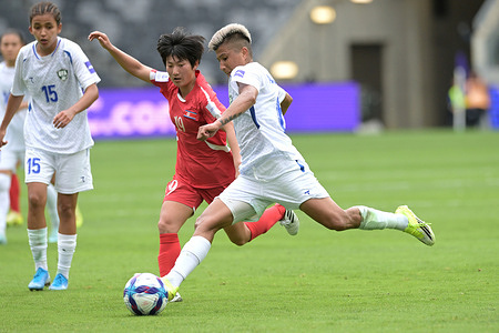 Dilrabo Asadova (front) of Uzbekistan women football team and Sin Hyang (back) of Democratic People's Republic of Korea women football team seen in action during the AFC 2026 Women Asia Championship Group match between Uzbekistan and Democratic People's Republic of Korea held at the Western Sydney Stadium. Final score Korea 3 : 0 Uzbekistan.