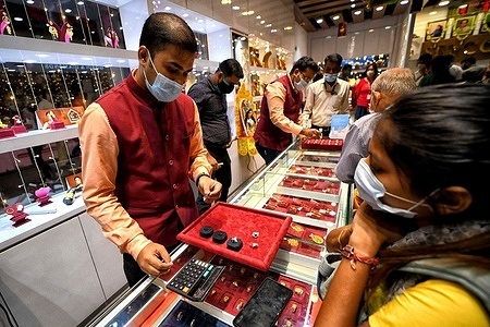 Gold traders display different golden ornaments to the customers during the Dhanteras festival day in Kolkata. 
Dhanteras is the most auspicious occasion for buying gold as per Hindu mythology it is believed that it will bring good fortune for the buyer, as a result demand for the golden jewellery is higher during this time.