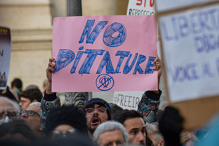 A protester holds a placard expressing his opinion during a demonstration in support of the Iranian people organized by Amnesty International and Woman Life Freedom for Peace and Justice at Piazza del Campidoglio.